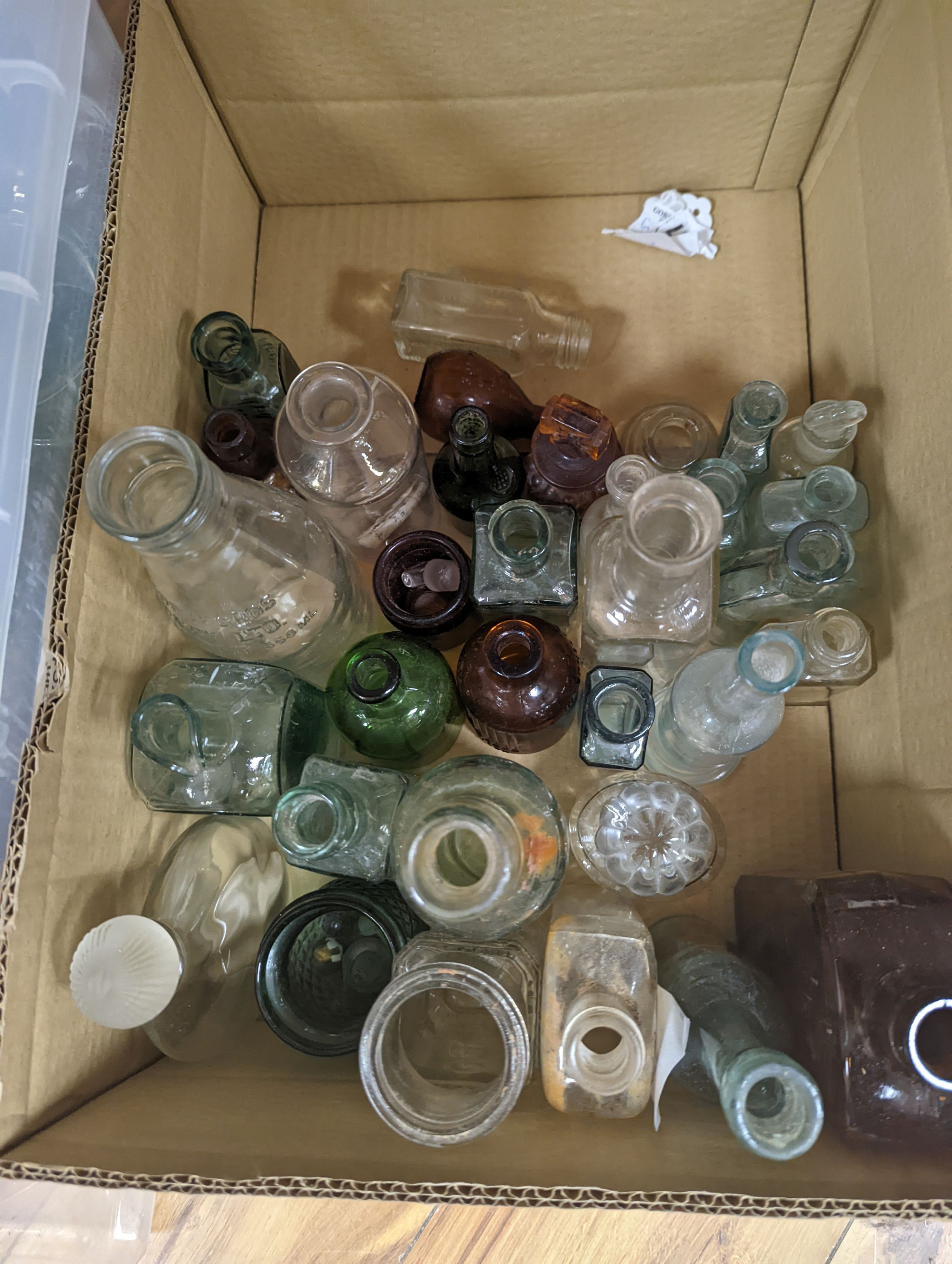 A collection of antique glass bottles and jars